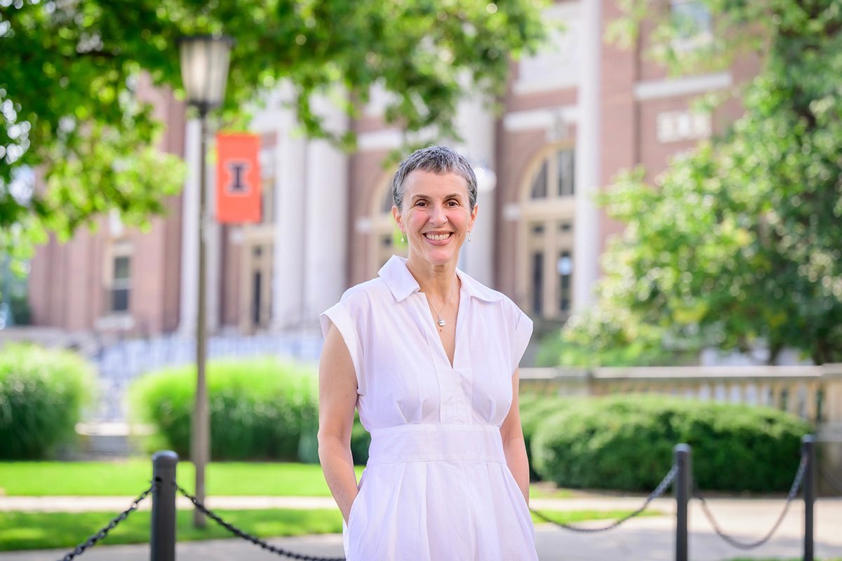 An image of Dr. Ilana Redstone. She is standing in front of Foellinger Auditorium and smiling at the camera.