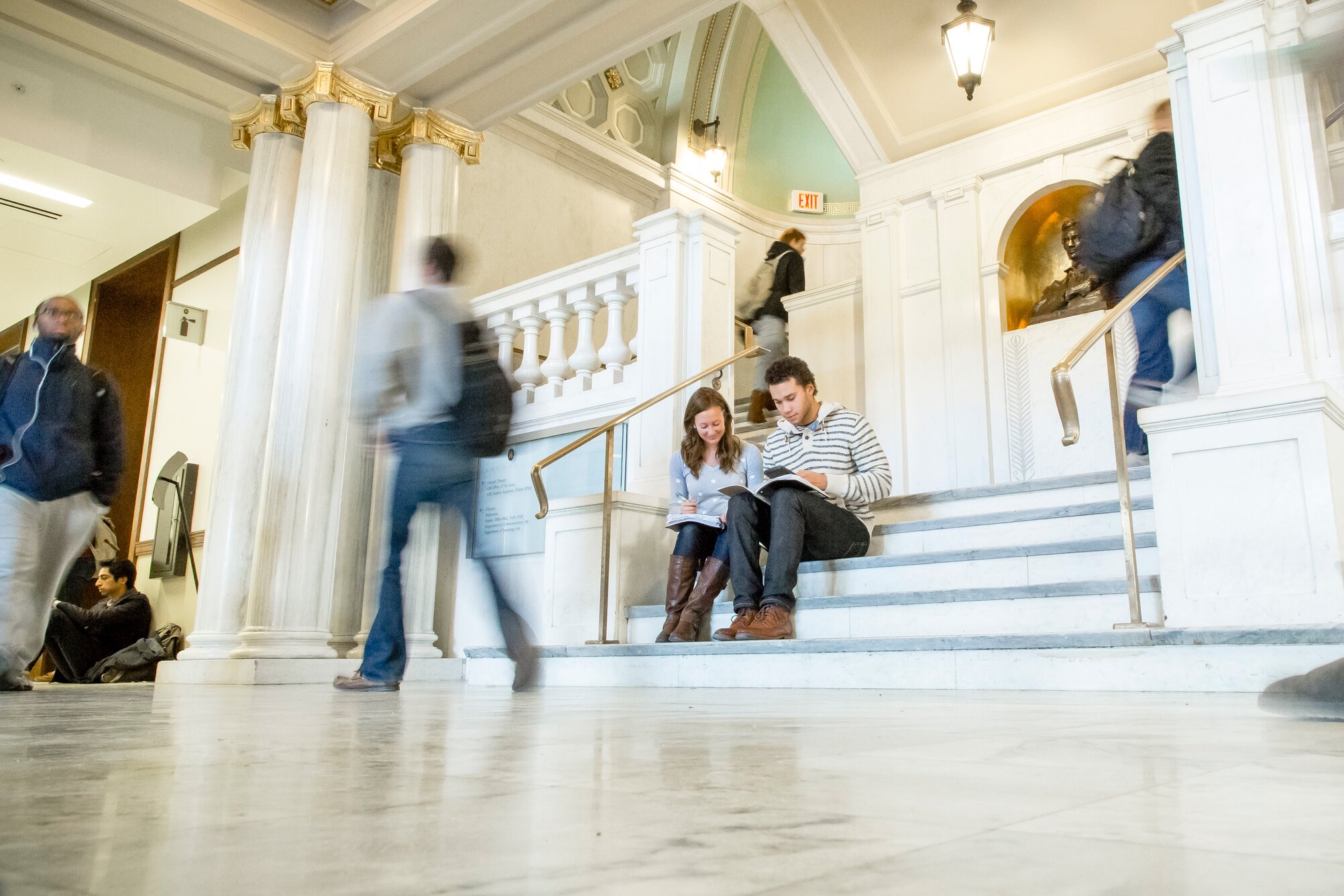 Students working in a crowded hallway