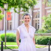 An image of Dr. Ilana Redstone. She is standing in front of Foellinger Auditorium and smiling at the camera.