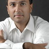 A photo of Eboo Patel looking at the camera.