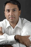 A photo of Eboo Patel looking at the camera.