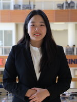 A photo of Olivia Chingis smiling at the camera.