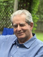 A photo of Neil MacKinnon smiling at the camera